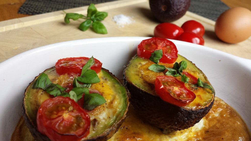 A healthy, quick oven dish with avocado, egg and tomato