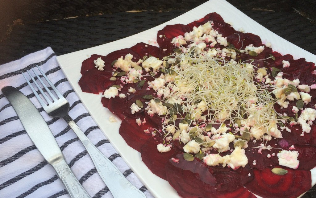 A fresh, colorful salad with creamy goat cheese and a sweet raspberry dressing