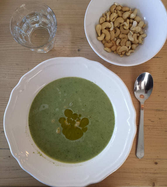 A creamy, bright soup full of vegetables and mint