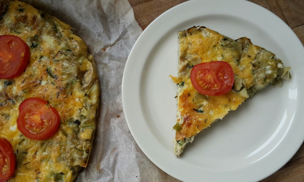 A light Italian omelette with courgette, artichoke hearts and fresh herbs