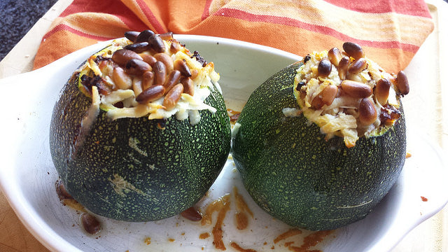 An Italian stuffed round zucchini with sun-dried tomatoes, basil and Parmesan