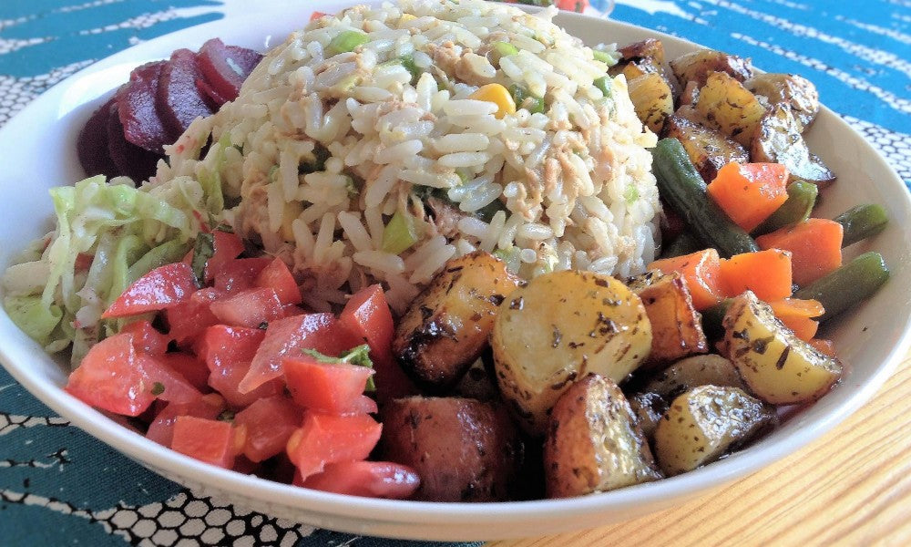 A colorful salad with rice, surimi, tuna and fresh vegetables