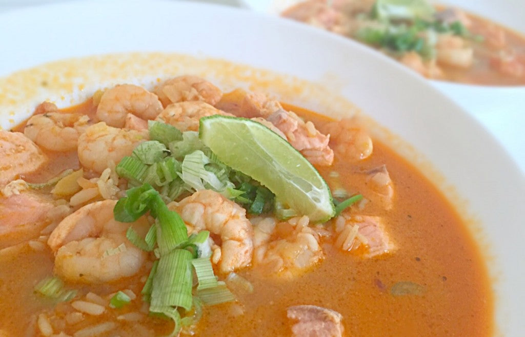 A warming Asian soup with salmon, prawns and rice