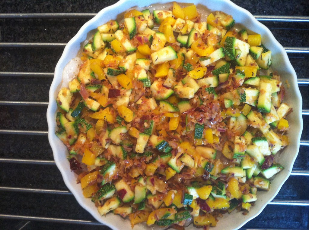 A healthy and flavorful dish with fish and oven-baked vegetables