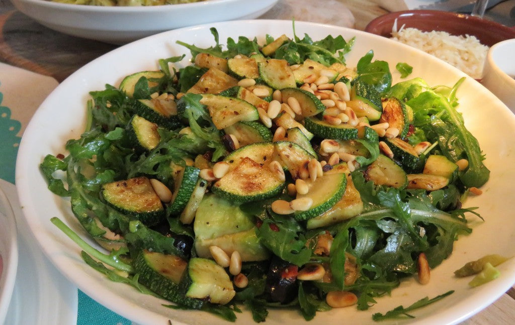 Fresh and nourishing salad with toasted pine nuts and creamy avocado