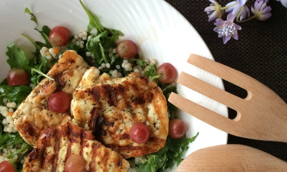 A fresh salad with grilled halloumi, pearl couscous and juicy grapes