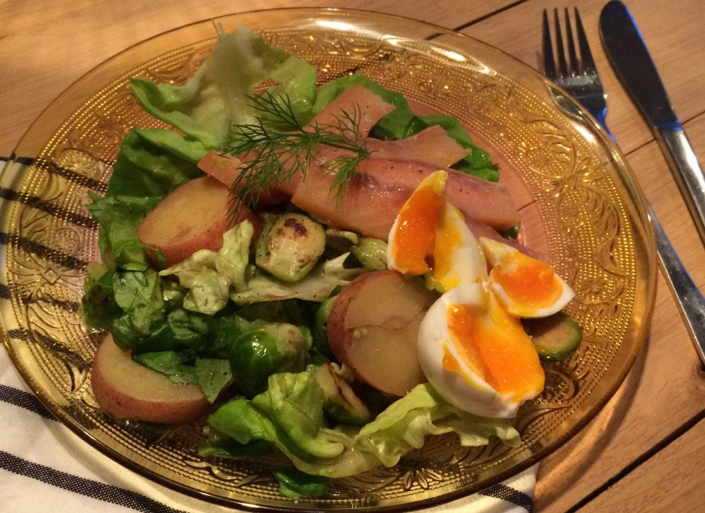 A fresh salad with crisp sprouts, creamy potatoes and tender smoked salmon