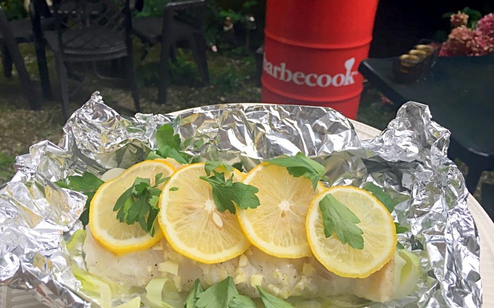 Juicy cod with leek and lemon, steamed in aluminum foil