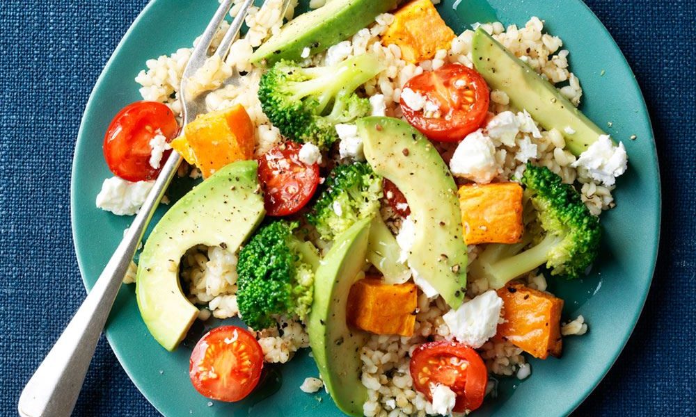 A nourishing meal with roasted sweet potato, bulgur and creamy avocado