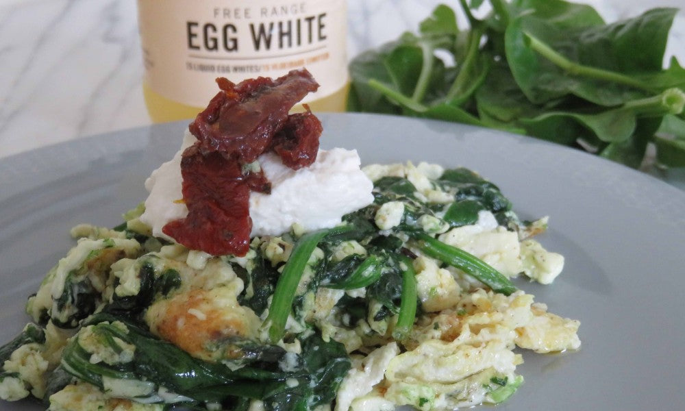 Creamy scrambled eggs with spinach, ricotta and sun-dried tomatoes