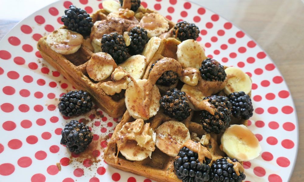 Healthy waffles with vegetables and fresh fruit on top