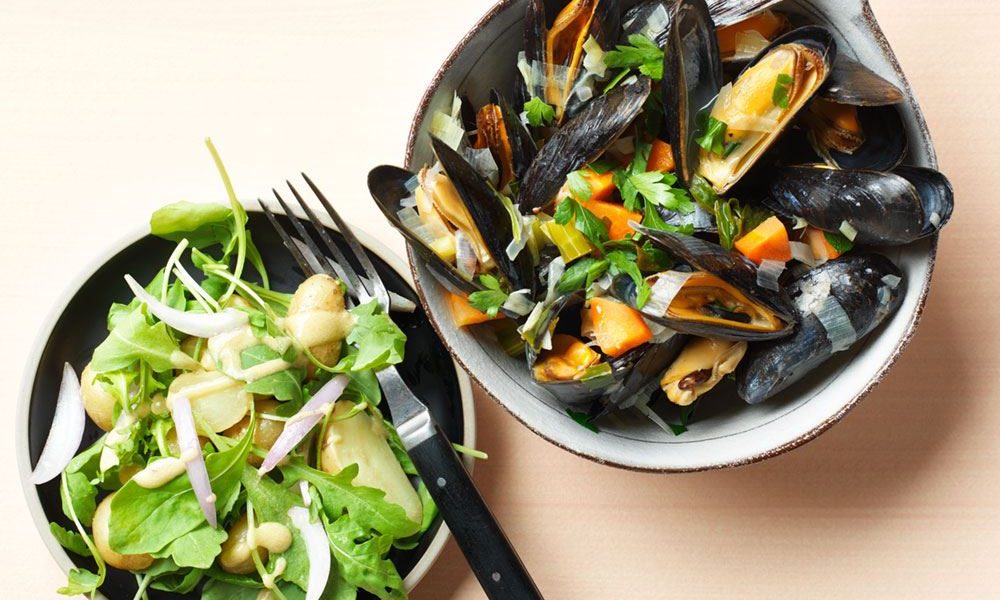 Fresh mussels with vegetables and a crisp baby potato salad with arugula