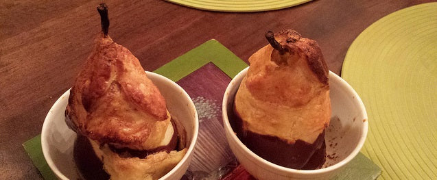Elegant baked pears in crispy puff pastry with a rich chocolate dip