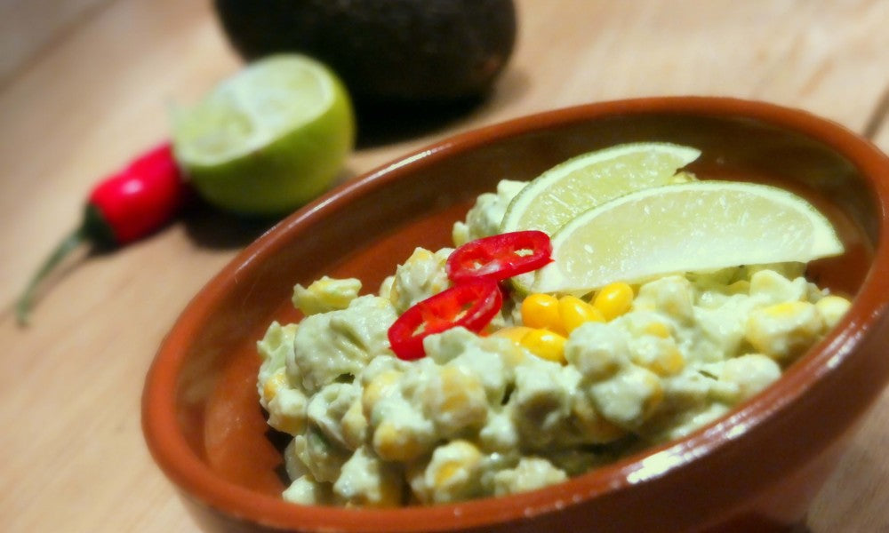 Fresh salad with creamy avocado, corn and a spicy lime-chili sauce